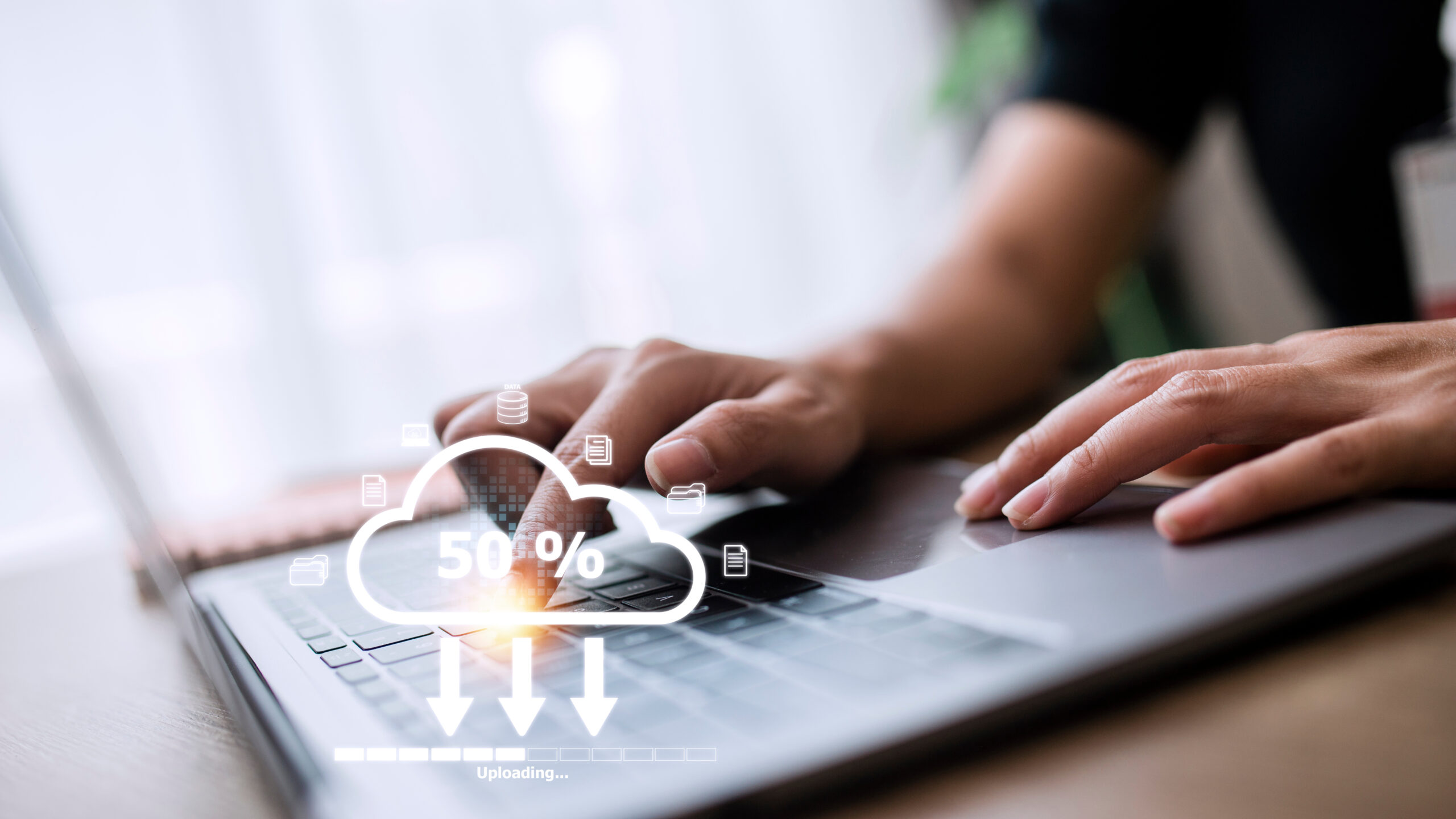Woman doing cloud uploading on laptop in office. Data infomation